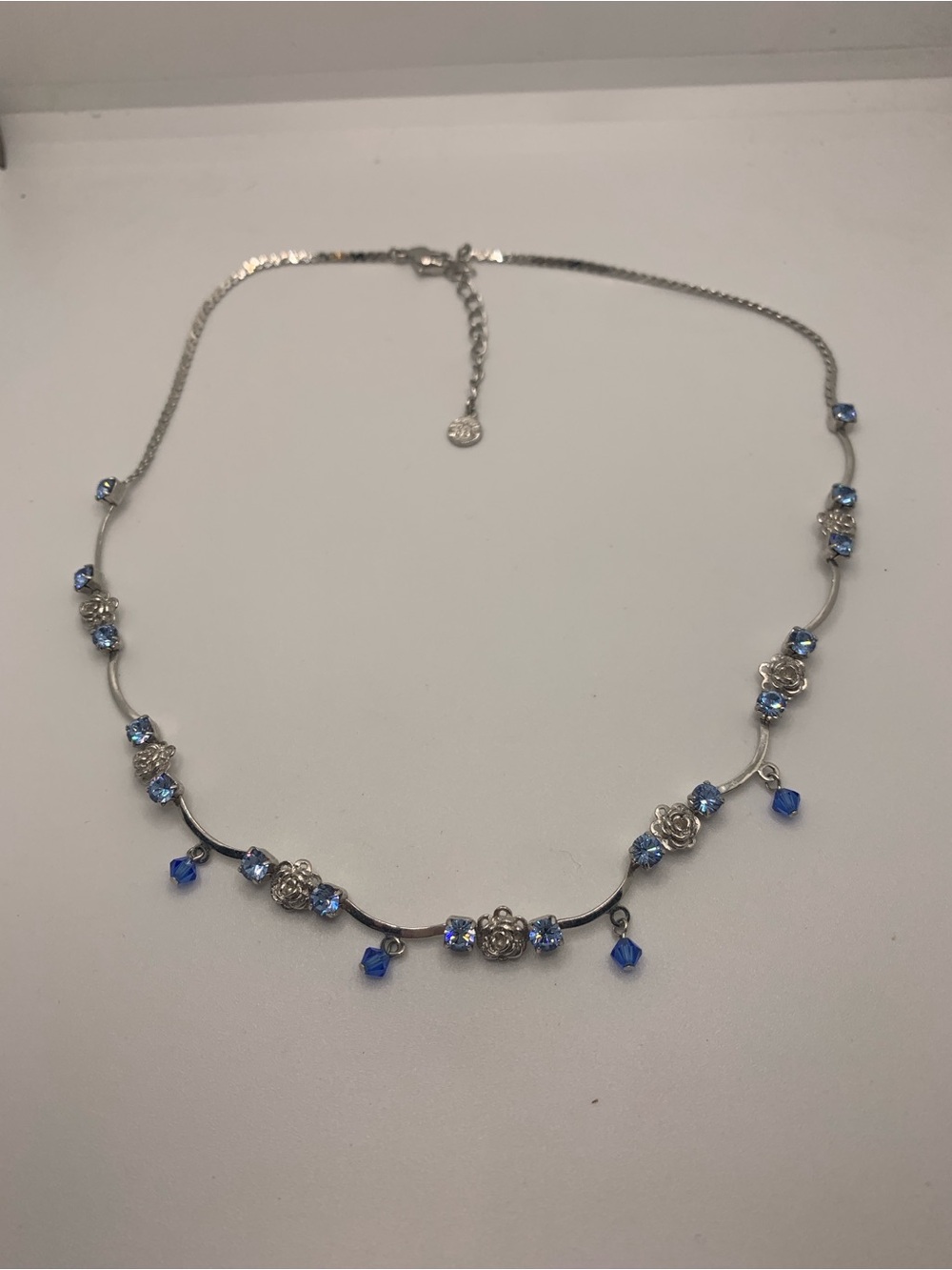 Silver Floral Necklace with Blue Crystal Accents